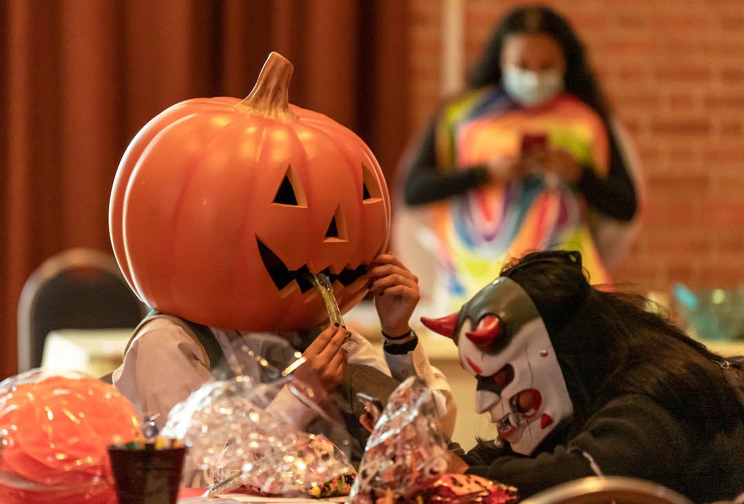 Students dressed up in Halloween costumes at RMC event