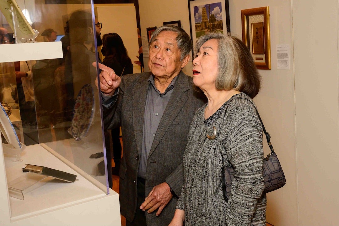 Attendees viewing "Our Vibrant AAPI Community" exhibition