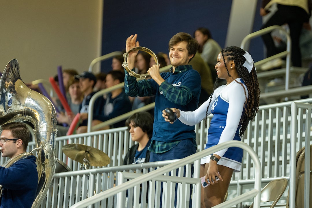 A band member and a cheerleader enjoy the atmosphere during the Rice men's basketball game against Charlotte Jan. 26 at Tudor Fieldhouse.