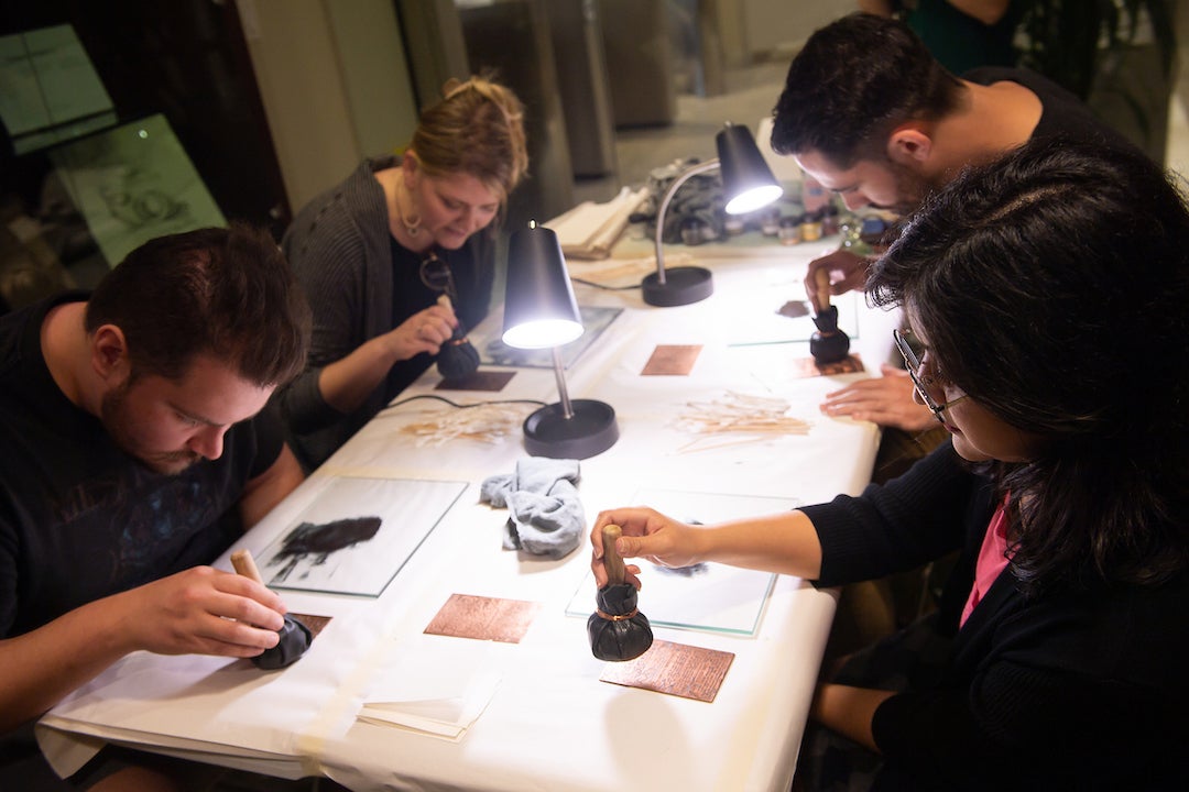 Rice students practice the printmaking process during a showcasing of the newly-acquired star-wheel copper-plate rolling press that famous Romantic poet and artist William Blake used to produce his masterworks this week at the Woodson Research Center in Fondren Library on March 1, 2023.