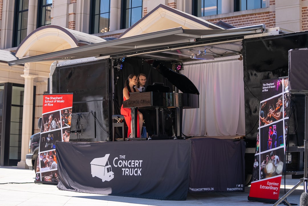 A photo of performers using The Concert Truck, a mobile concert hall, outside Rice University's Brockman Hall for Opera. 