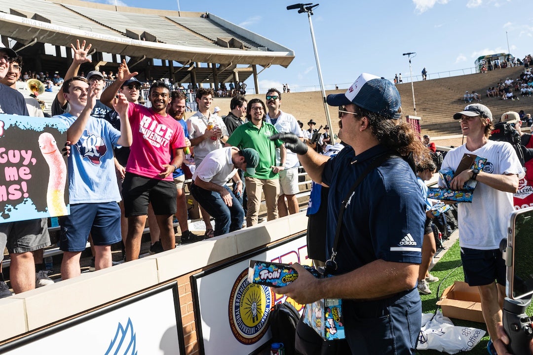 Rice Athletics 'gummy guy,' Daniel Domian, passes out gummy worms at the Tulane game Oct. 28.