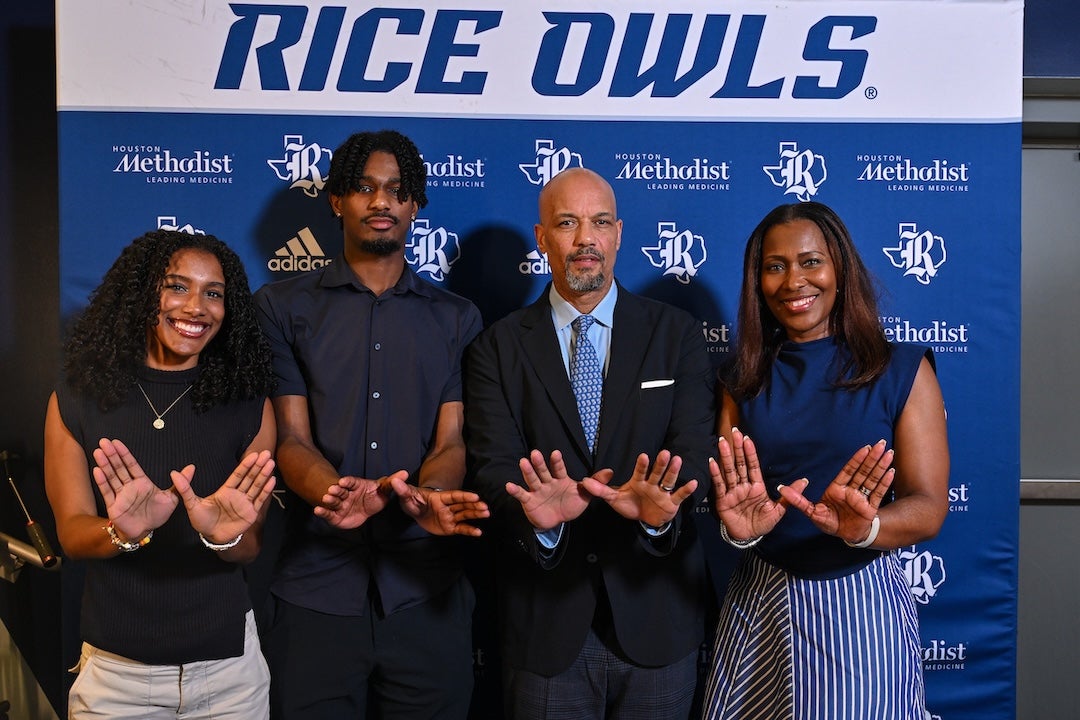 Rob Lanier (middle right) takes a photo with his family at his introductory press conference.