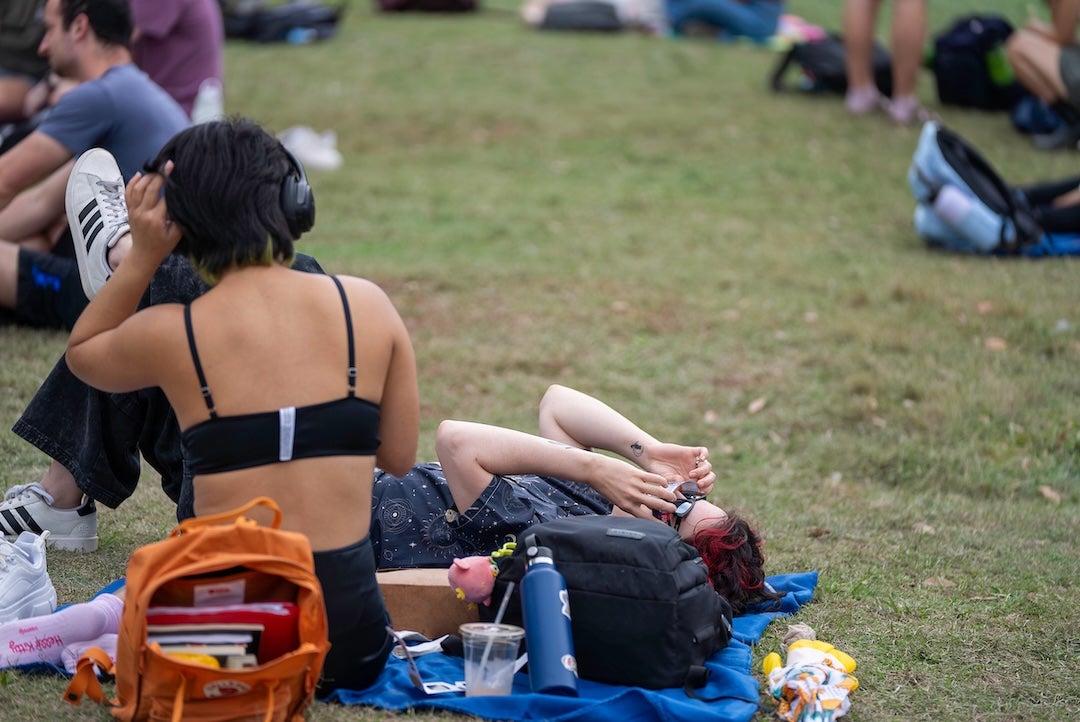 A student views the eclipse on April 8, 2024 at the central quad.