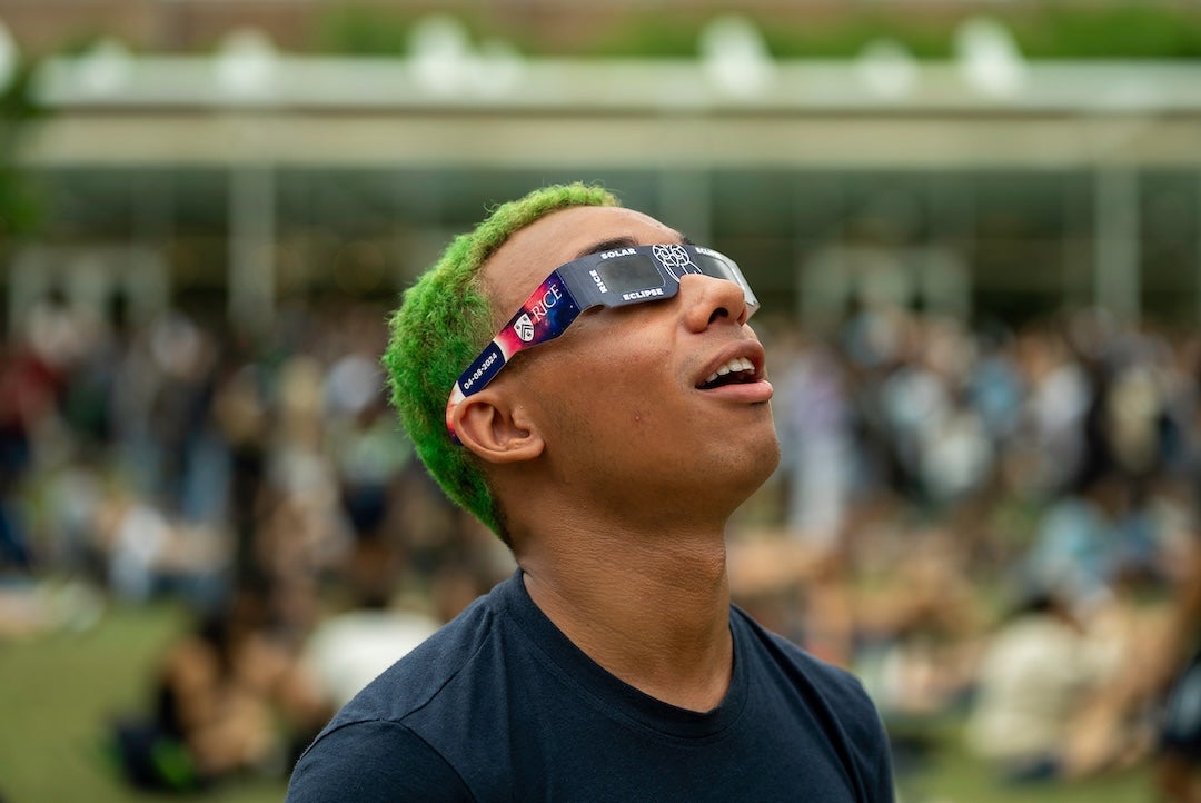 A student views the eclipse on April 8, 2024 at the central quad.
