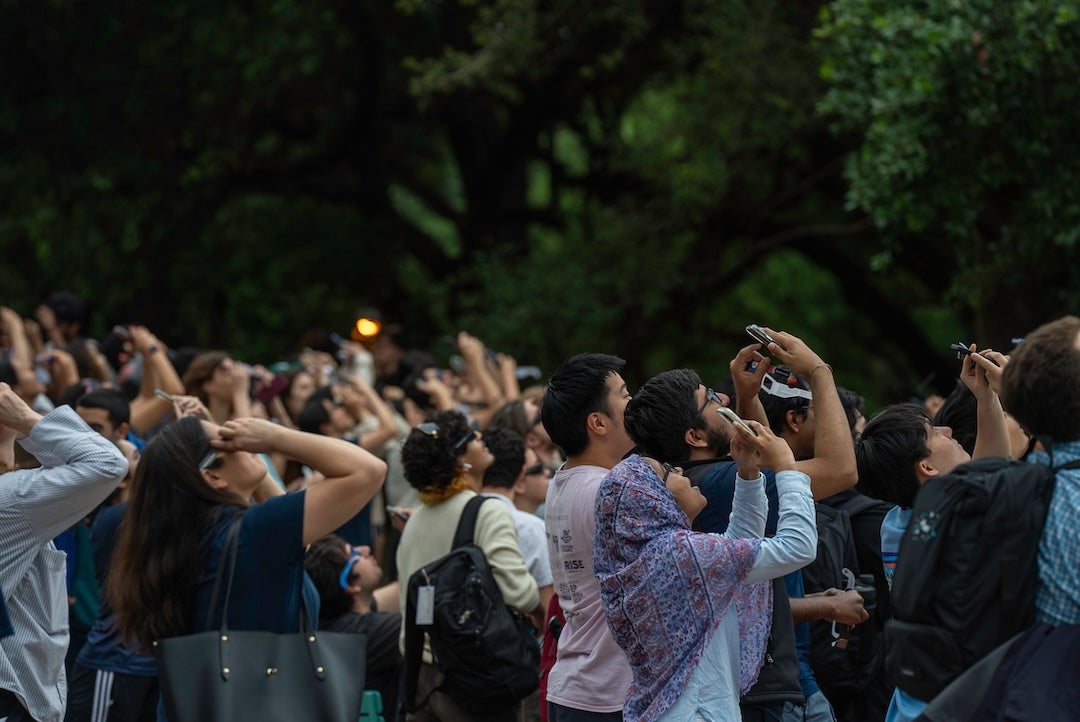 Students view the eclipse on April 8, 2024 at the central quad.