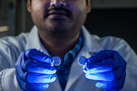 Pramanik holding the batteries. 