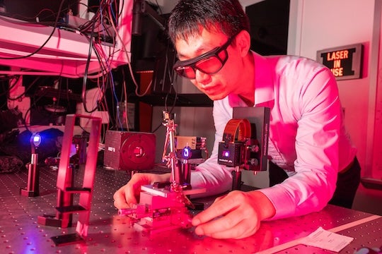 researcher in the laser lab