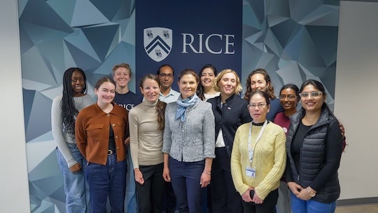 A group of scientists stand with the Crown Princess of Sweden