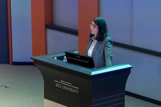 woman behind a podium speaking