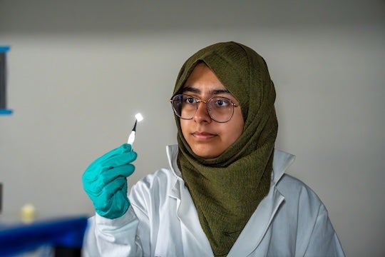 researcher holding sample