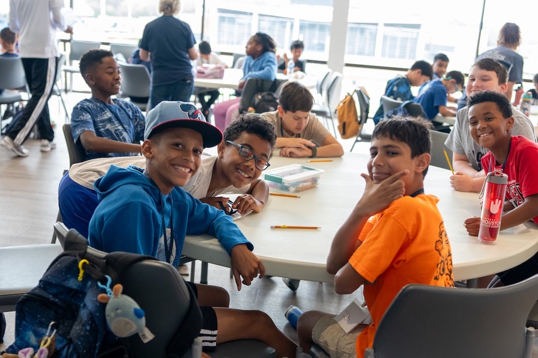 students pose for a photo during the STEM-Letics camp