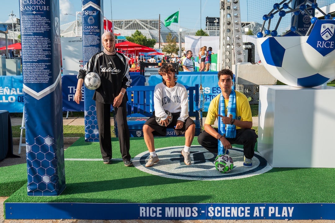 Fan Fest attendees pose for a photo at the Rice booth in June of 2026.