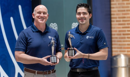 Lane Martin and Jorge E. Vidal hold the Telly Awards
