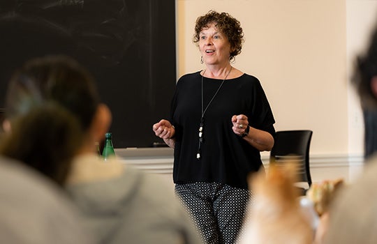 Kathleen Canning speaking in a classroom