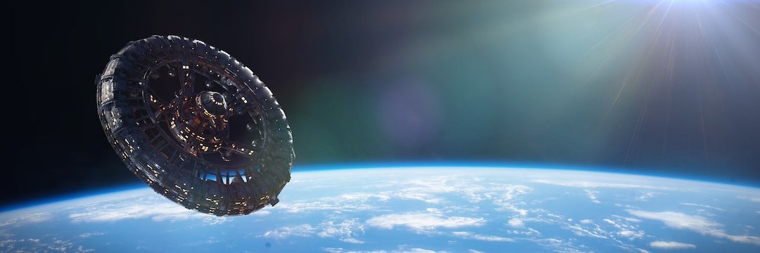 A circular space station orbits the earth
