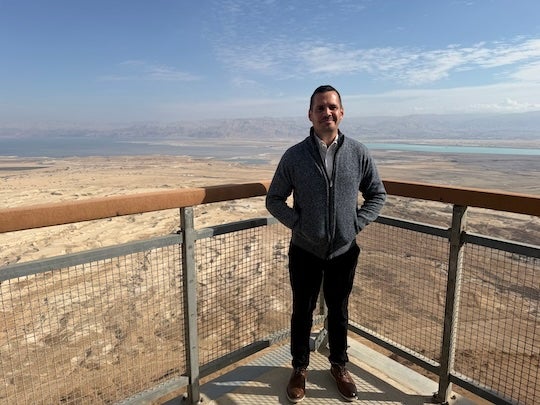 Craig Considine at Masada, an ancient fortress overlooking the Dead Sea, during a recent faculty fellowship trip to Israel.
