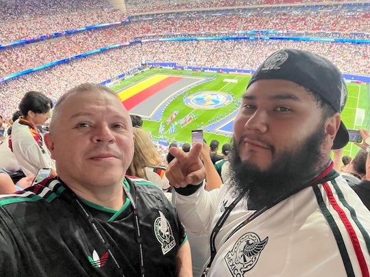 Benitez with his son-in-law Gustavo Duran at the Germany vs Curacao game in Houston.