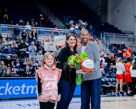 Jenny Cafferty getting honored at a 2025 women's basketball game