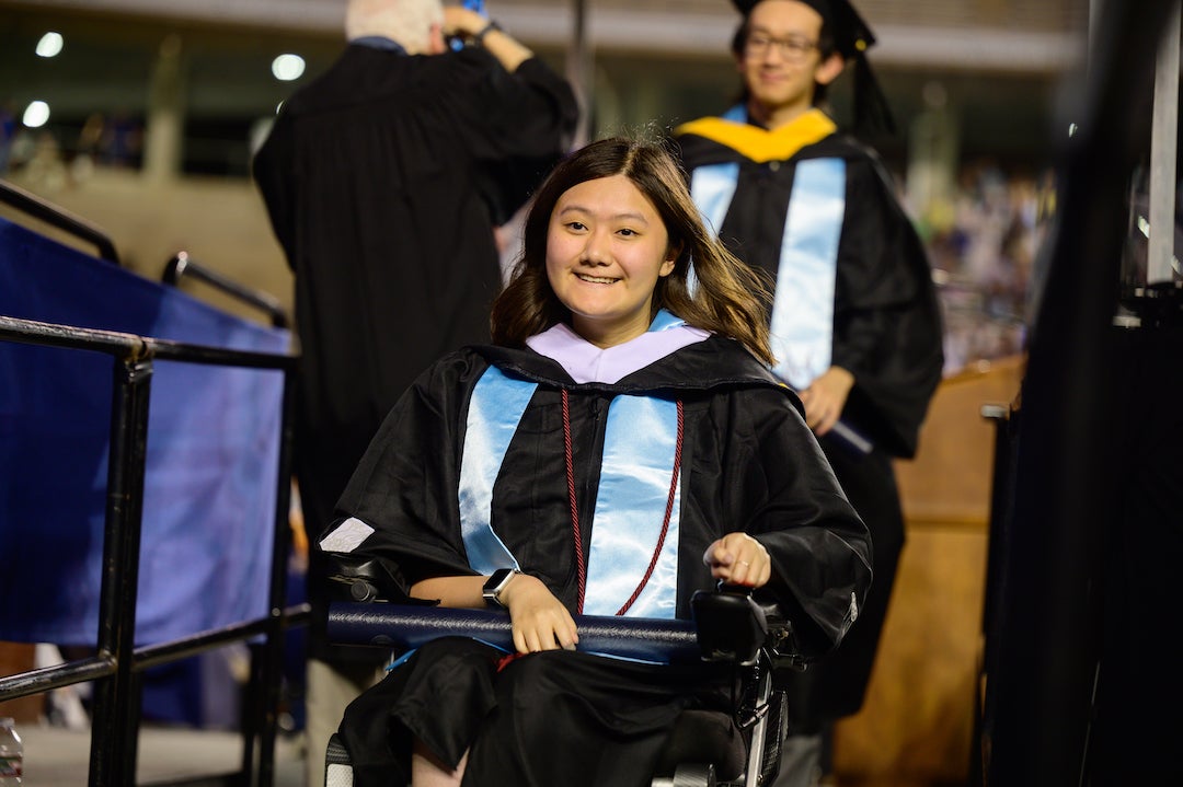Student processing after receiving degree during Rice commencement 2023