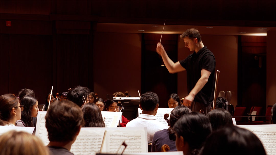 Kyle Haake conducting the Campanile Orchestra