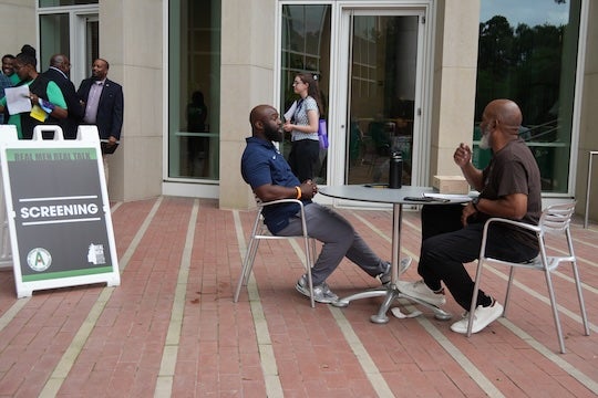 Participants take part in a mental health screening outside Rice University’s Bioscience Research Collaborative during the “Real Men Real Talk” conference.
