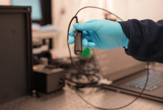 PrecisionView is a handheld endomicroscope that overcomes limitations in medical imaging by combining advanced optics with deep learning 