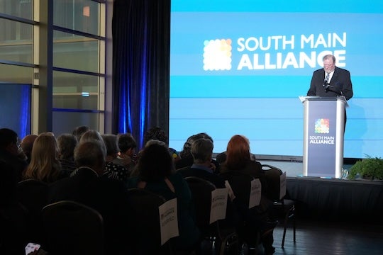Greg Marshall ’86, Rice’s director of university relations and South Main Alliance board chair, welcomes guests to the organization’s 50th anniversary celebration at NRG Stadium.