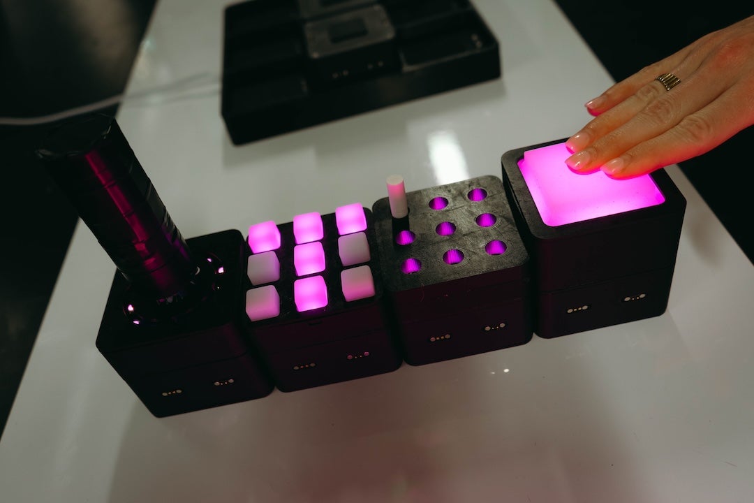 The different modular tiles target specific functions, including elbow and wrist movement, fine motor skills, finger extension, wrist rotation and grip strength. 