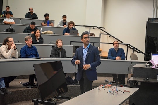 Pinheiro presenting his work at Rice. 