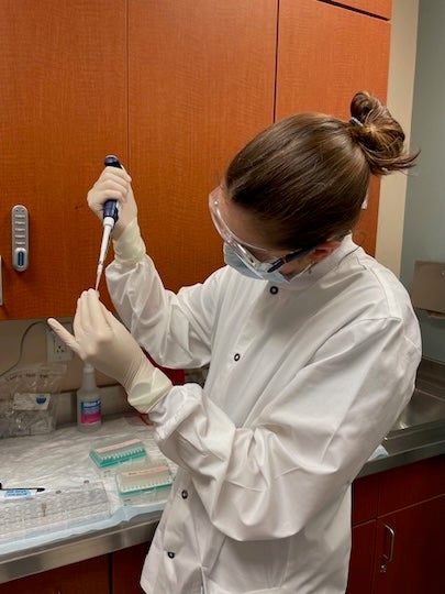 Emilie Newsham Novak working with the samples at The University of Texas MD Anderson Cancer Center. 