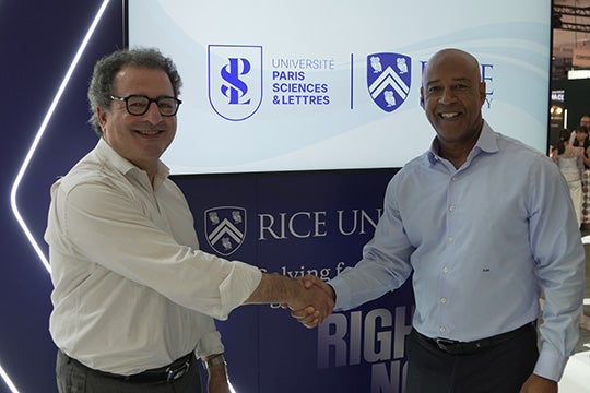 Reginald DesRoches shaking hands with El-Mouhoub Mouhoud, president of PSL