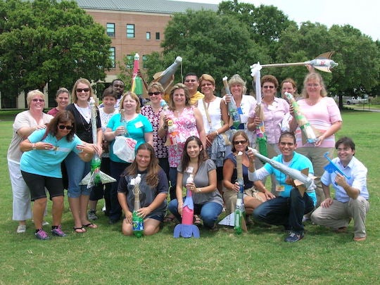 A group of educators pose for a photo at a past AP Summer Institute.