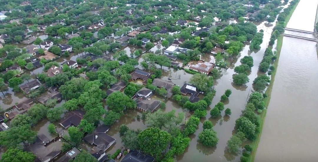 Floodwaters surround homes in the Meyerland neighborhood following the April 2016 Tax Day flood in Houston.