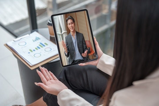Woman conducting video conference call. 