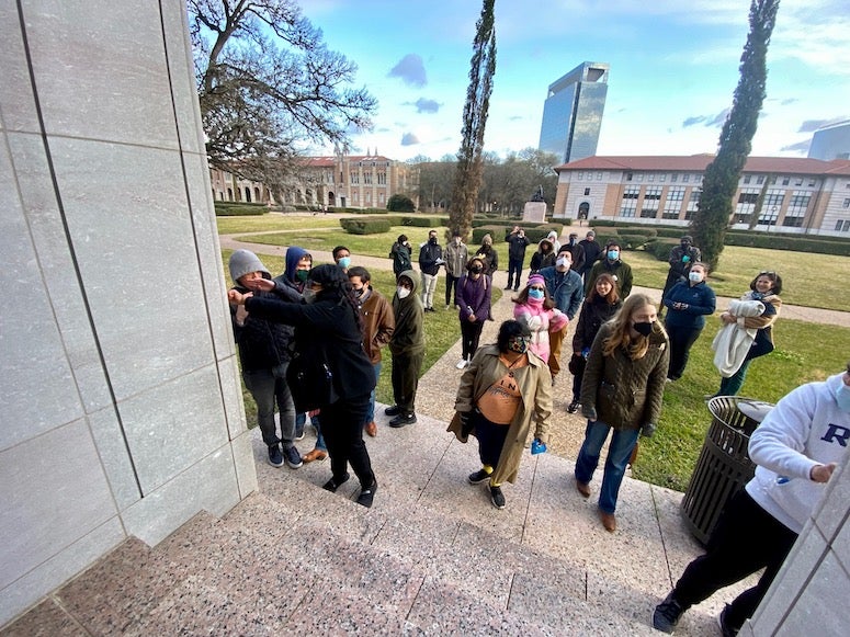 Visitors play with the "frog wall" outside Anderson Hall.