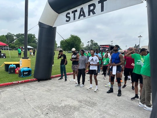 Participants gather at the starting line for the 5K walk and run during Black Men’s Wellness Day in Houston, part of a two-day initiative focused on health and community.