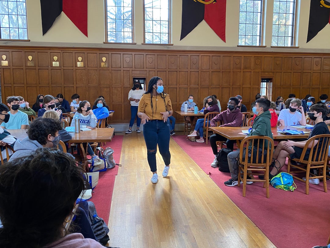 Jones College junior Taylor Gilliam addresses a group of high school students in the Baker College commons.
