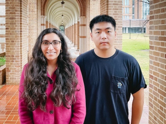 Gori and Weng under arches at Rice University
