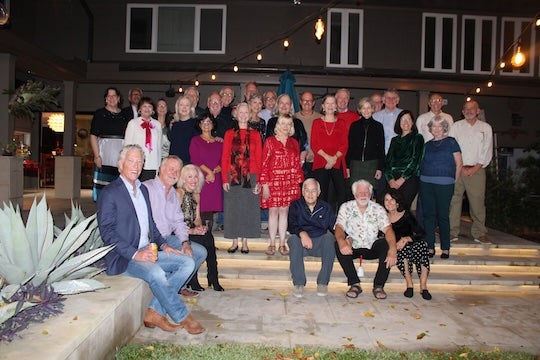 Members of the Rice Friends’ Christmas party gather for their annual holiday reunion, a tradition that began in a Lovett College dorm room in 1974.