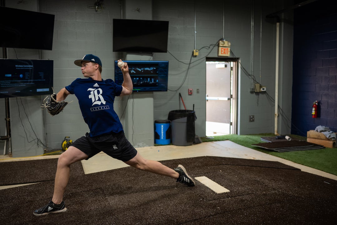 Rice Owls pitcher Tom Vincent throws while his performance is analyzed by various sport analytics software.