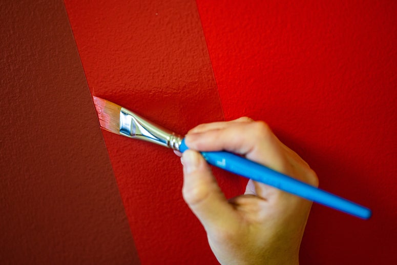 A detail shot of Kate Shepherd's wall painting "Tricycle Red, Pelican Gray etc., partial octagons"