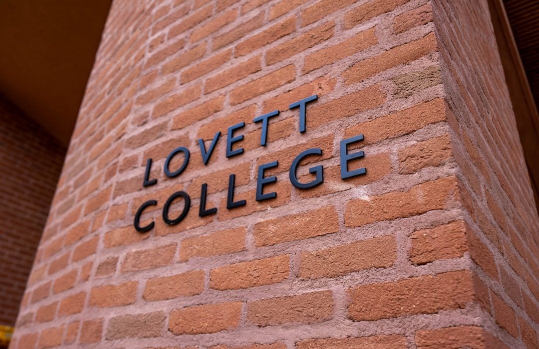 A brick column displaying the Lovett College name