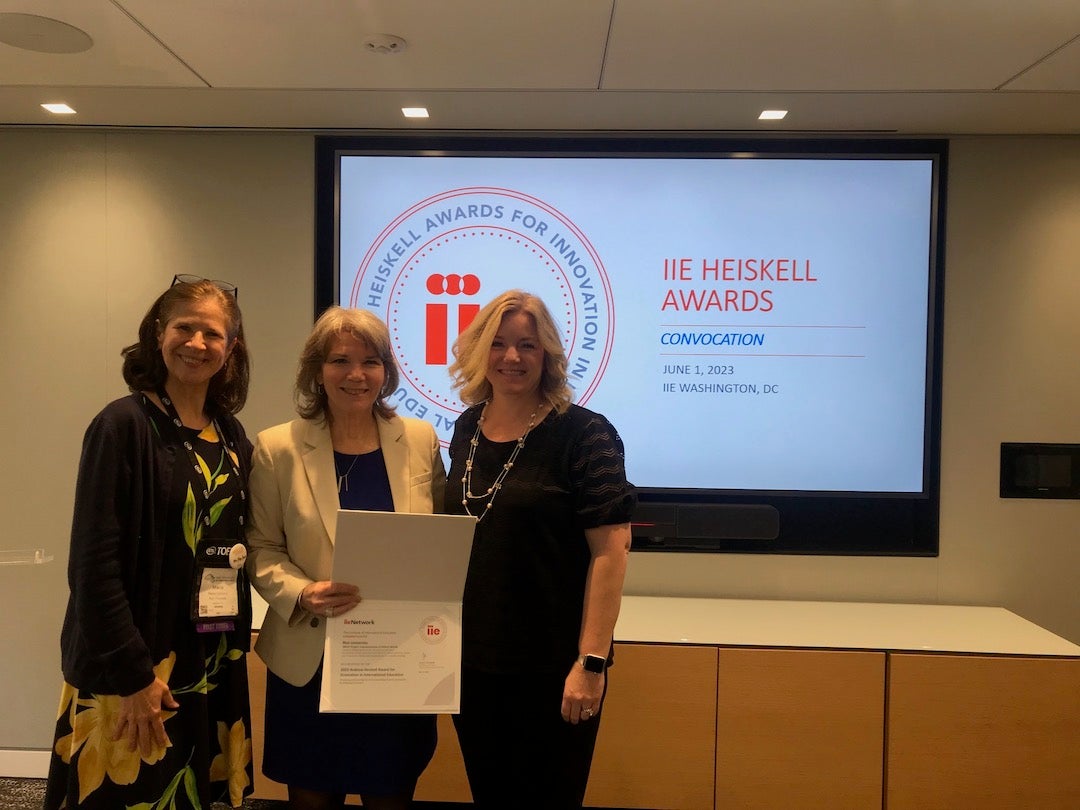 Maria Corcuera and Adria Baker of Rice OISS receive award from IIE's Michelle Pickard.