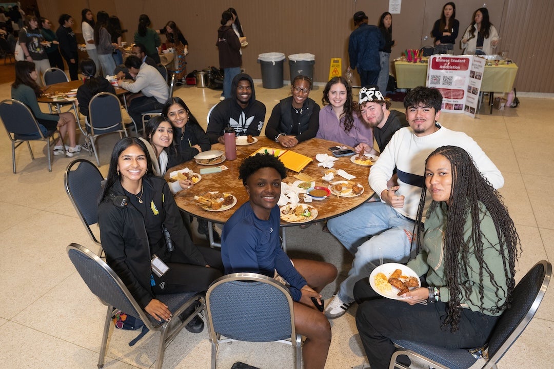 Students eat at the Pangea Potluck event in November 2024