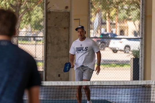  Rice President Reginald DesRoches participates in a pickleball tournament at the new Pickle Lab, located in the Ion District. 