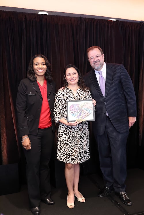 Ruth López Turley receives award from Children at Risk.