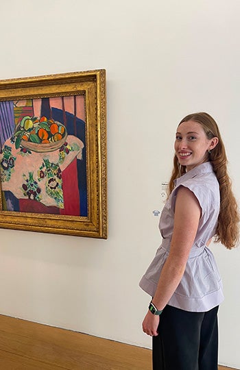 Karlianna Kapche pictured with artwork in Paris