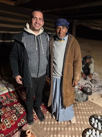 Craig Considine with Sheikh Salman in a traditional Bedouin tent in the Negev Desert.