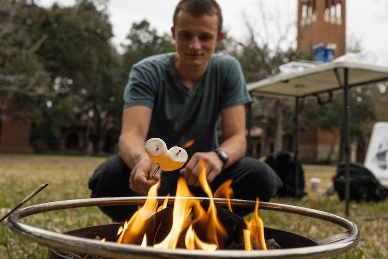 Students were treated to freshly-made s’mores roasted over an open fire during a camping demonstration in the central quad by Kris Cortez, assistant director of outdoor programs at the Gibbs Recreation and Wellness Center